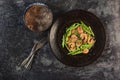 Healthy food stir fried shrimp asparagus teriyaki in plate on black slate table