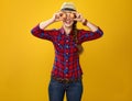 Happy woman grower holding eggs in front of face like eyes