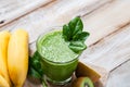 Healthy food and vegan diet concept - jar of fresh green juice or smoothie with kiwi, spinach, banana, apple. Antioxidant detox Royalty Free Stock Photo