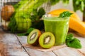 Healthy food and vegan diet concept - jar of fresh green juice or smoothie with kiwi, spinach, banana, apple. Antioxidant detox Royalty Free Stock Photo