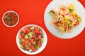 Healthy food. Vegetarian slates on a white plate. salad of crab, cucumber, corn, tomato and lettuce on a colored background Royalty Free Stock Photo