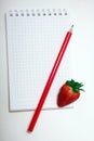 Healthy Food Vitamin Concept. Delicious strawberry on board on white background with empty paper notebook. Royalty Free Stock Photo