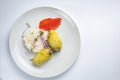 Healthy food on a white plate and a white background