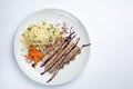 Healthy food on a white plate and a white background