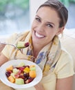 Healthy food, woman in portrait with fruit in salad and diet, organic breakfast and relax on sofa with smile for weight Royalty Free Stock Photo