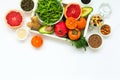 Healthy food in wooden tray: fruits, vegetables, seeds and greens on white background Royalty Free Stock Photo