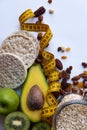 Healthy food and yellow tape measure over brown table. Fitness and health concept. Royalty Free Stock Photo