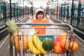 Healthy food for young family with kids. Boy at grocery store or supermarket. Portrait of funny little child holding Royalty Free Stock Photo