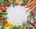 Healthy foods, cooking and vegetarian concept fresh carrots with cherry tomatoes, garlic, lemon radish, peppers, cucumbers, butter