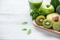 Healthy foods. Green smoothie for detox, diet, superfoods. Green apple, lemon, kiwi, cucumber, avocado and green leaves. Royalty Free Stock Photo