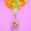 Healthy foods and medicine concept. Bottle of vitamin C and various citrus fruits. Citrus fruits sliced lime,orange and lemon on Royalty Free Stock Photo