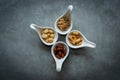 Healthy Foods. Mixed nuts in white bowls with nuts for diet on a concrete table. Different kinds of tasty and healthy nuts. Royalty Free Stock Photo