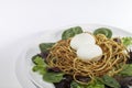 Healthy free range hen`s egg salad with spiralized potato nest