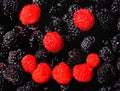 Healthy and fresh breakfast with berries assortment. Human mimic shape made by red and black raspberries. Colorful fruit Royalty Free Stock Photo