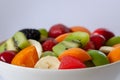 Healthy fresh fruit salad in white plate. Top view. Royalty Free Stock Photo