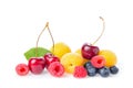 Healthy fresh fruits. Composition of ripe red sweet cherry with horns, raspberries, apricots and blueberries with leaf isolated on Royalty Free Stock Photo