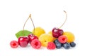 Healthy fresh fruits. Composition of ripe red sweet cherry with horns, raspberries, apricots and blueberries with leaf isolated on