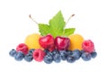 Healthy fresh fruits. Composition of ripe red sweet cherry with horns, raspberries, apricots and blueberries with leaves isolated Royalty Free Stock Photo