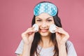 Healthy fresh girl removing makeup from her face with cotton pad. Beauty woman cleaning her face with cotton swab pad isolated on Royalty Free Stock Photo