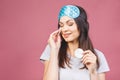 Healthy fresh girl removing makeup from her face with cotton pad. Beauty woman cleaning her face with cotton swab pad isolated on Royalty Free Stock Photo