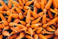 Heap of fresh carrots displayed in a farmer`s market. Royalty Free Stock Photo