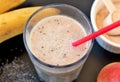 Healthy fresh smoothie drink from red apple, banana chia seeds and plant protein powder in the glass with straw Royalty Free Stock Photo