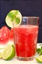 Healthy fresh smoothie drink from red watermelon, lime, mint and ice drift Royalty Free Stock Photo