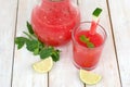 Healthy fresh smoothie drink from red watermelon, lime, mint and ice drift Royalty Free Stock Photo