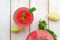 Healthy fresh smoothie drink from red watermelon, lime, mint and ice drift Royalty Free Stock Photo