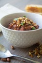 Traditional Georgian vegan kidney beam stew lobio with chopped walnuts and parsley 