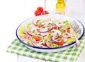 Healthy fresh summer salad with letucce, radish, cherry tomatoes, red onion and champignons with italian herbs Royalty Free Stock Photo