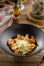 Healthy fresh vegetable Caesar Salad with shrimp, parmesan Cheese and Croutons on wooden table Royalty Free Stock Photo