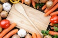 Healthy,fresh vegetables with wooden spoon and board