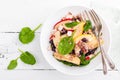 Healthy fruit and berry salad with fresh apples, cranberries, walnuts, italian ricotta cheese and spinach leaves. Delicious and nu Royalty Free Stock Photo