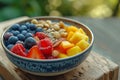 Healthy fruit bowl with mixed berries and nuts on a wooden table Royalty Free Stock Photo