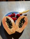 Healthy fruit breakfast of papaya and strawberries