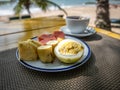 Healthy fruit breakfast on the sunny beach Royalty Free Stock Photo