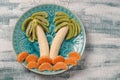 Healthy fruit salad for children of kiwi, bananas and tangerines Royalty Free Stock Photo