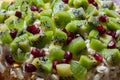 Healthy fruit salad kiwi and pomegranate background