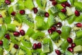 Healthy fruit salad kiwi and pomegranate background