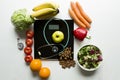 Healthy fruit,vegetables and stethoscope on scales. Weight loss and right nutrition concept Royalty Free Stock Photo