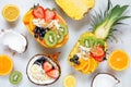 Healthy fruit yogurt bowl table scene on white marble Royalty Free Stock Photo