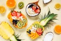 Healthy fruit yogurt bowls table scene on a pale yellow background Royalty Free Stock Photo