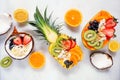 Healthy fruit yogurt bowl top view table scene over white marble Royalty Free Stock Photo