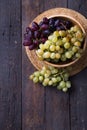 Healthy fruits Red and White wine grapes on wooden backgrounds Royalty Free Stock Photo