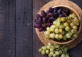 Healthy fruits Red and White wine grapes on wooden backgrounds Royalty Free Stock Photo