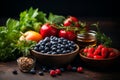 healthy fruits and vegetables arranged out on a table with dark background Royalty Free Stock Photo