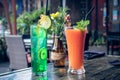 Healthy fruity papaya juice and lemonade in a glass on a wooden table. Bali island.