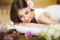 A healthy girl relaxing on the massage table. Before the procedure in the spa. Masseur goes to massage his back. Body care. Skin c Royalty Free Stock Photo