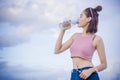 Healthy girl`s drinking water in the bottle , drink for thirstily for Refreshing Royalty Free Stock Photo